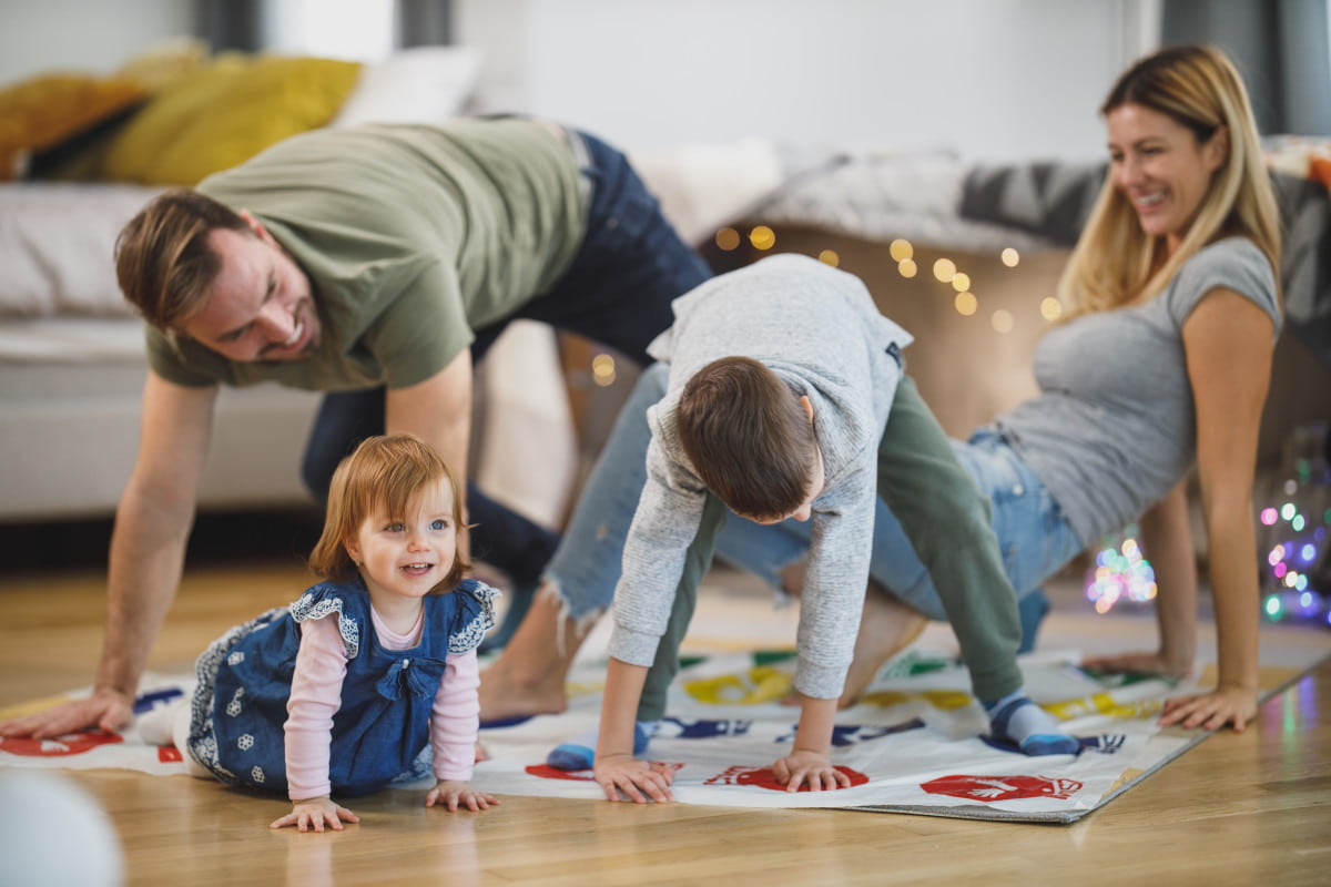 family playing games together happy bonding Christmas